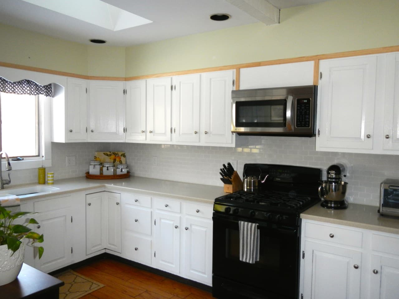 Upgrading Kitchen Cabinet Trim - School House Rehab